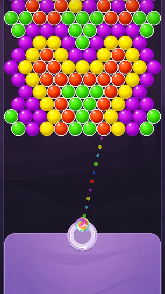 Skärmbild från Bubble Shooter Rainbow med prickad siktlinje från nederkanten