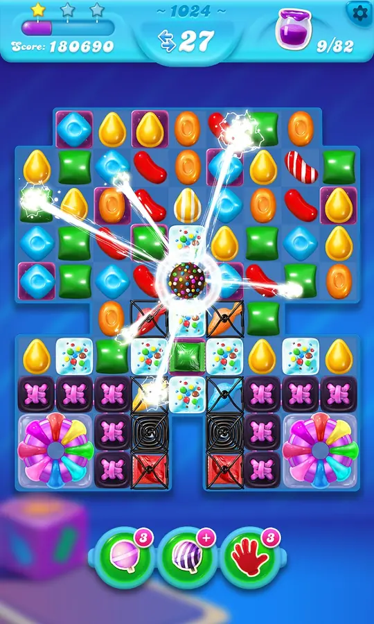 Skärmbild från Candy Crush Soda Saga med ett bräde av godis och is